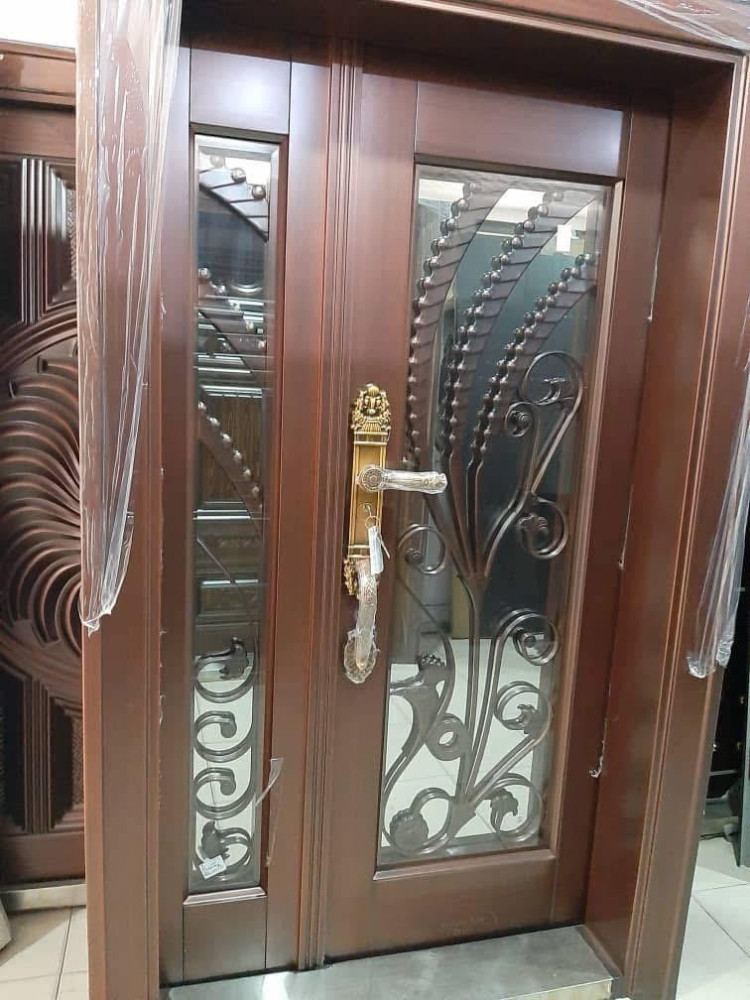 This double Steel Security Door with glass panels and decorative wrought iron insert