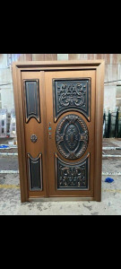 Cast Copper Security Door with an Ornate Black Design