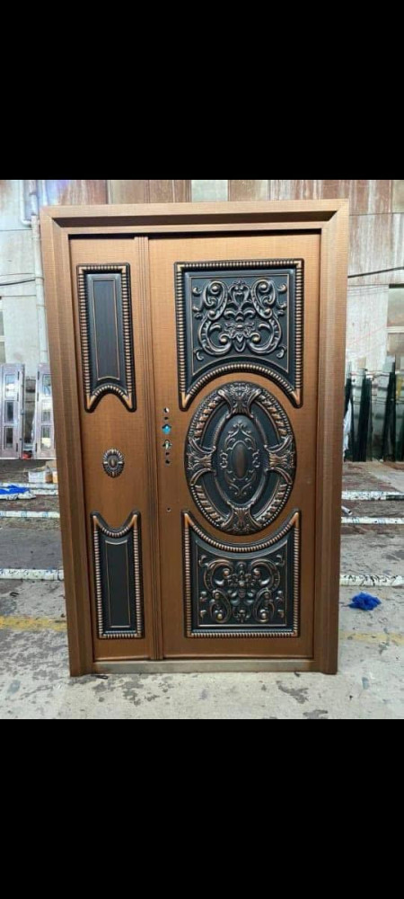 Cast Copper Security Door with an Ornate Black Design