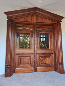 Double Wooden Front Door with a surrouding frame