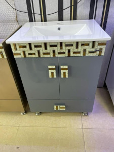 Floor-standing bathroom vanity unit with a white integrated ceramic basin