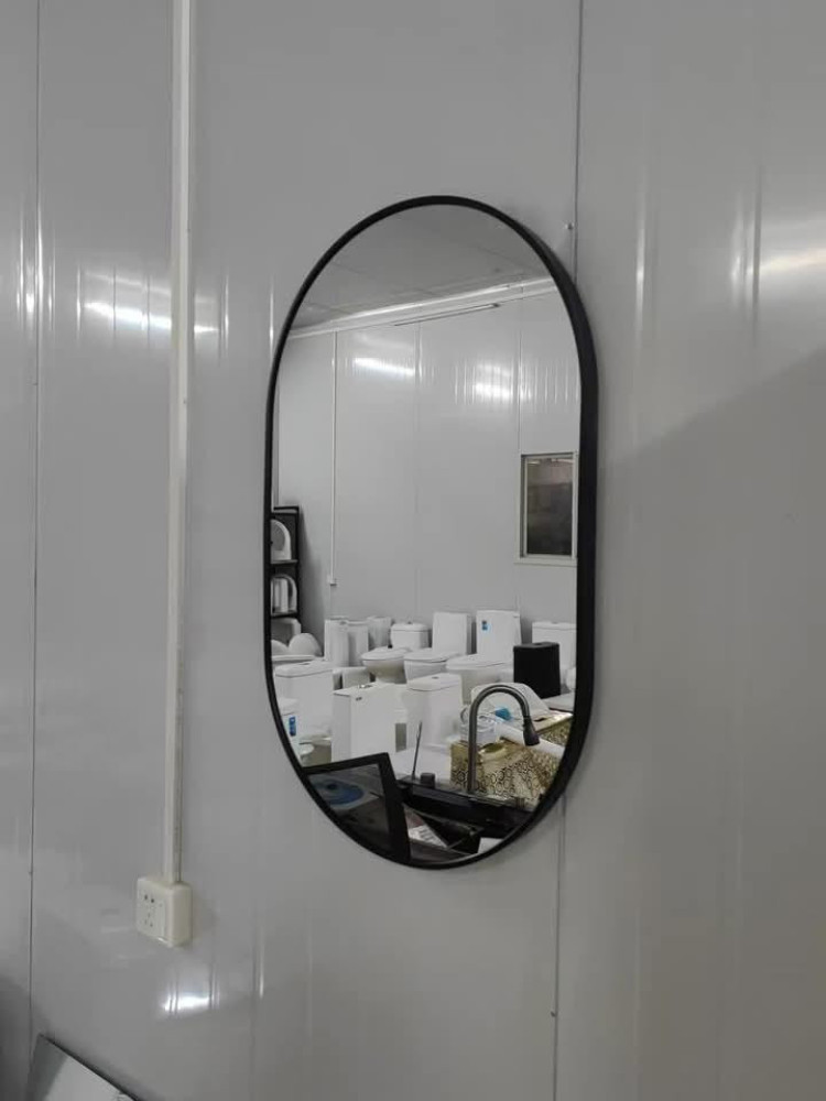 Modern black Ovl-frmed wall mirror