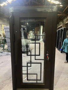 Modern Single Entry Iron Door with a geometric glass design