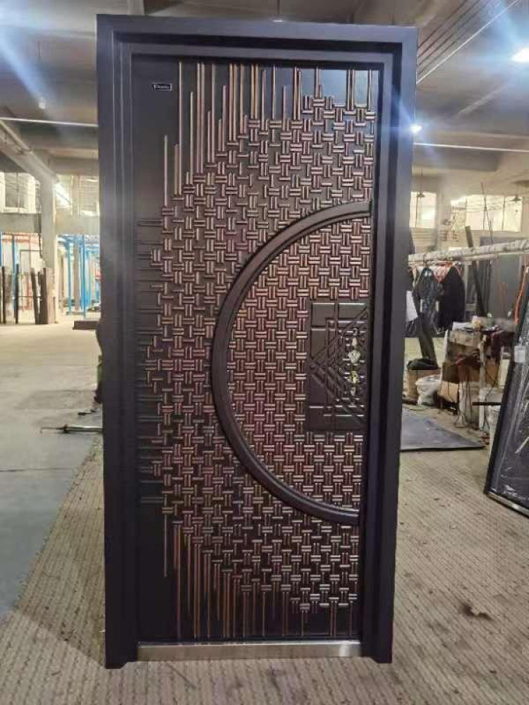 Cast Copper Security Door with a decorative wooven pattern