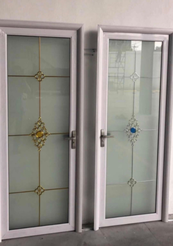 Aluminum-framed glass door with frosted lower panel and a black handle