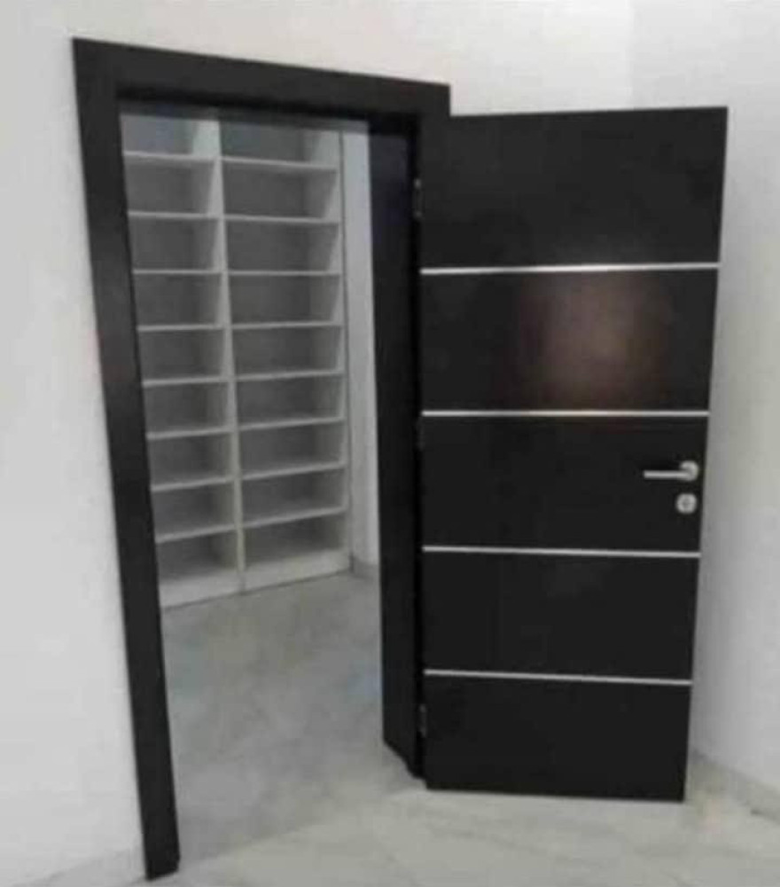 Black High-Density Fiberboard flush room door with horizontal silver accent lines