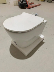 Modern wall-hung toilet with a concealed cistern and a black tempered glass panels