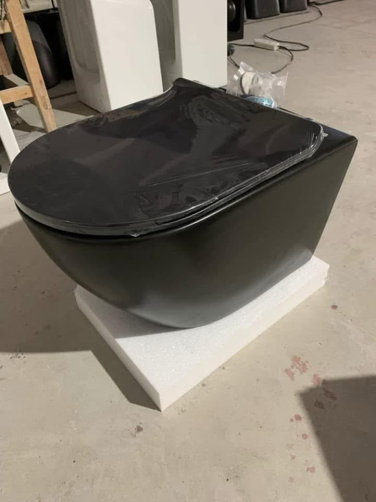 Zibra white-black super executive water closet toilet with a matching wall-mounted sink