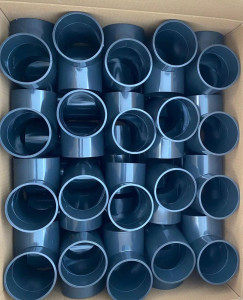 Displays grey PVC pipe fitting 