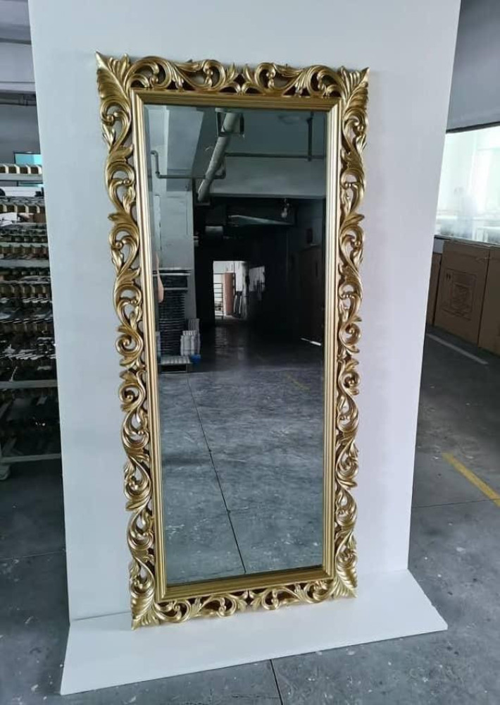 Antique gold baroque-style full-length floor mirror with a hand-carved wooden frame