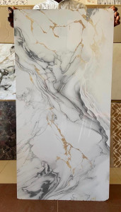 PVC marble sheet with a white, gray and gold veined pattern