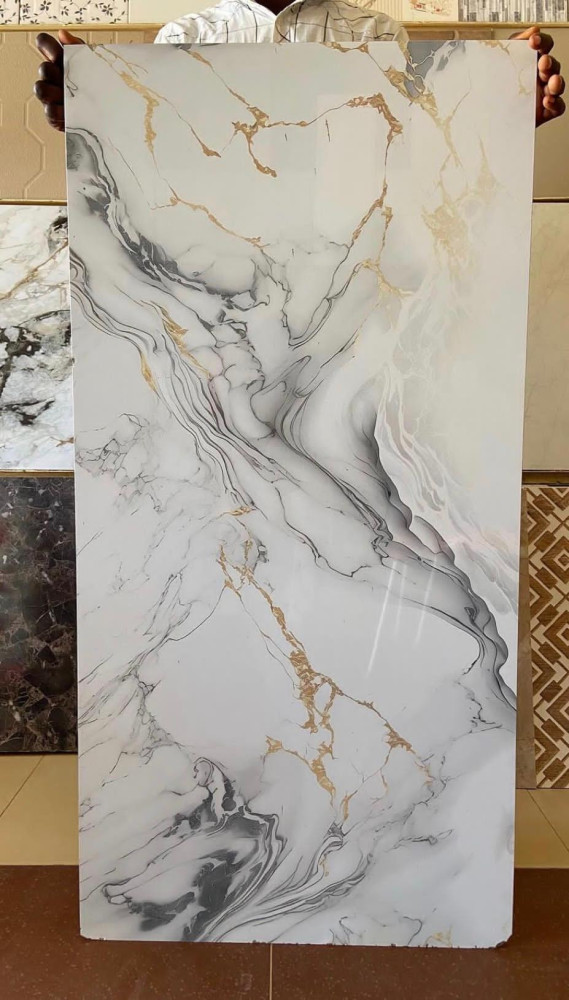 PVC marble sheet with a white, gray and gold veined pattern