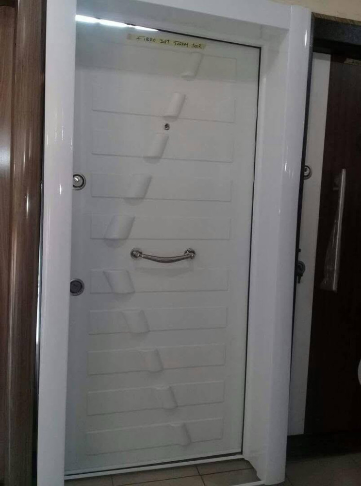 White Modern Turkish Security Door with a long Stainless Steel pull handle 