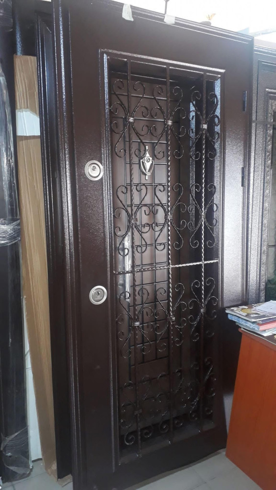 Israeli-style Security Door with an ornate metal security grille overlay