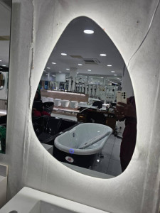 illuminated Led bathroom mirror with and irregular, organic shape