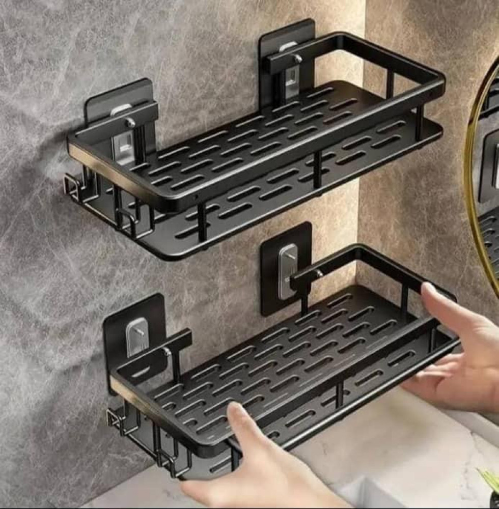 Two black wall-mounted bathroom organizer shelves