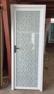 White Aluminum-framed Swing bathroom door with a patterned glass panel 
