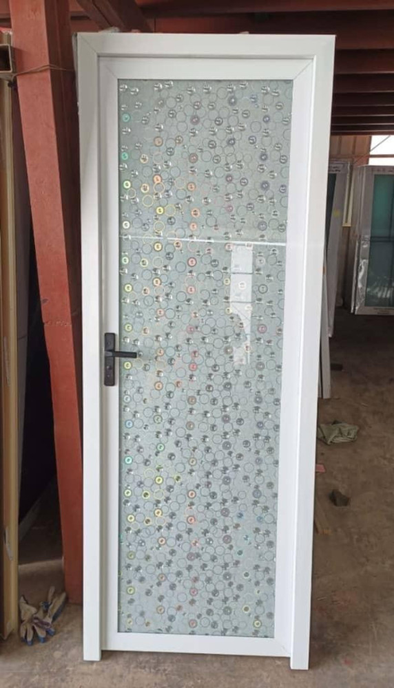 White Aluminum-framed Swing bathroom door with a patterned glass panel 