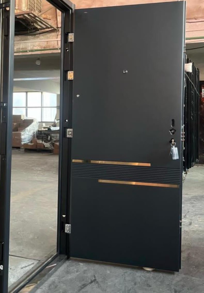 Modern Black Steel Security Door with gold-coloured horizontal accents