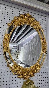 Decorative Oval wall Mirror with a Gold-coloured, ornate, floral-patterned frame