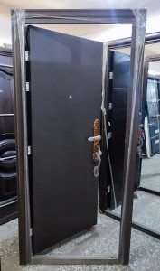 Dark-coloured Security Door with a Decorative gold-toned handle