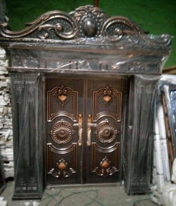 Brown and Black Cast Copper Security Door with ornte arch and pillars