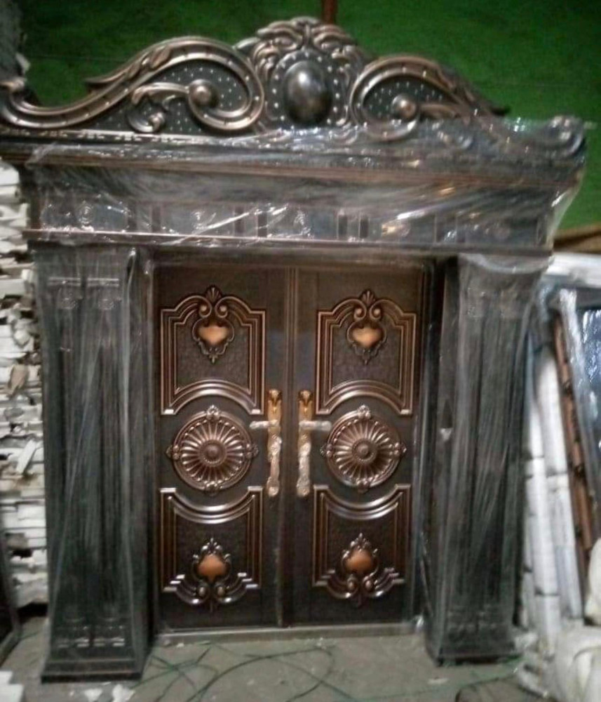 Brown and Black Cast Copper Security Door with ornte arch and pillars