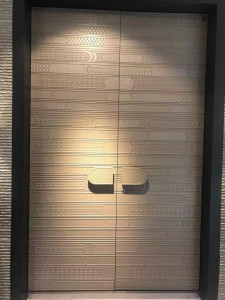 Contemporary door with a textured geometric pattern and minimalist handles