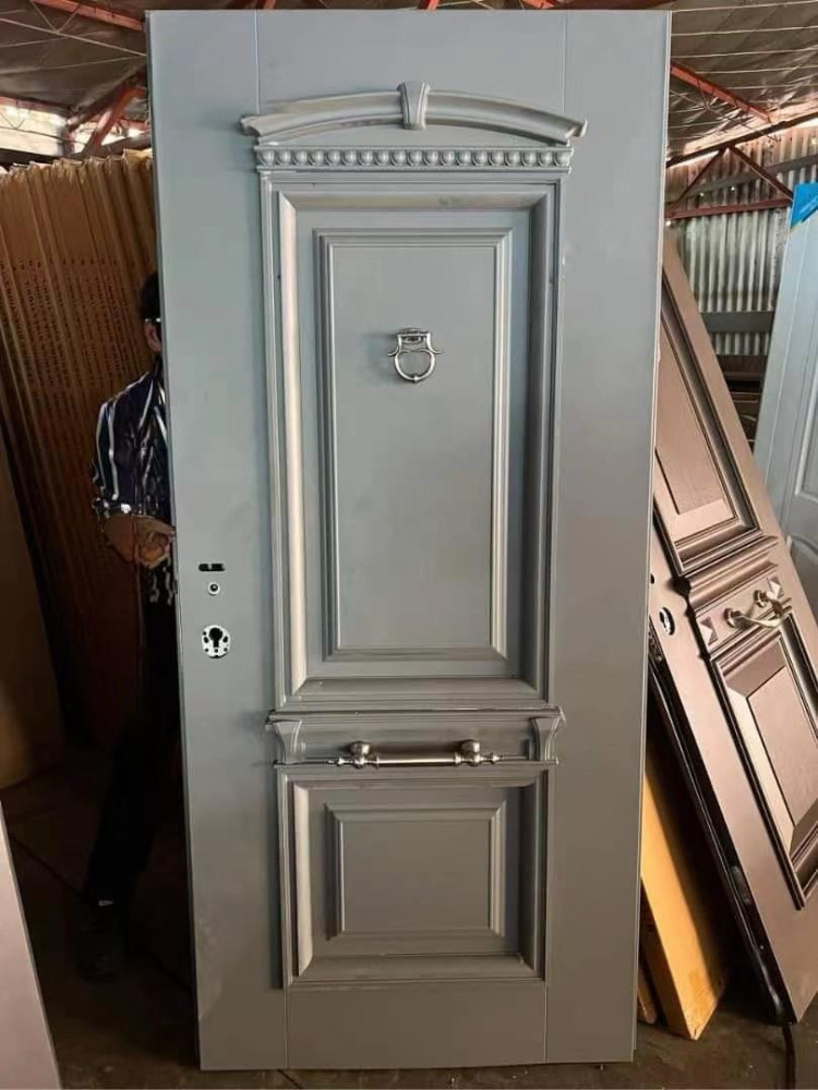 Gray Steel Security Door with a decorative design and multi-point locking systems
