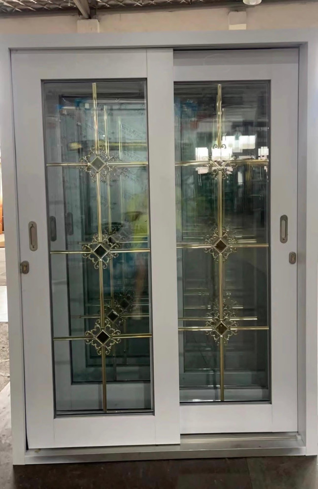 White Sliding Glass Patio Door with decorative brass-finish grilles