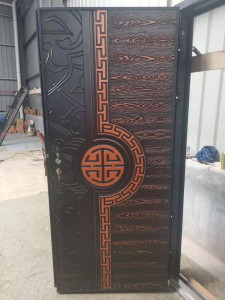Cast Security Door featuring a decorative possibly copper or Aluminum panel design