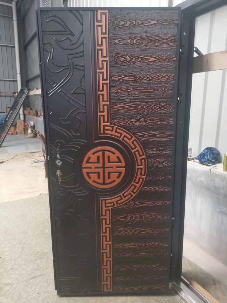 Cast Security Door featuring a decorative possibly copper or Aluminum panel design