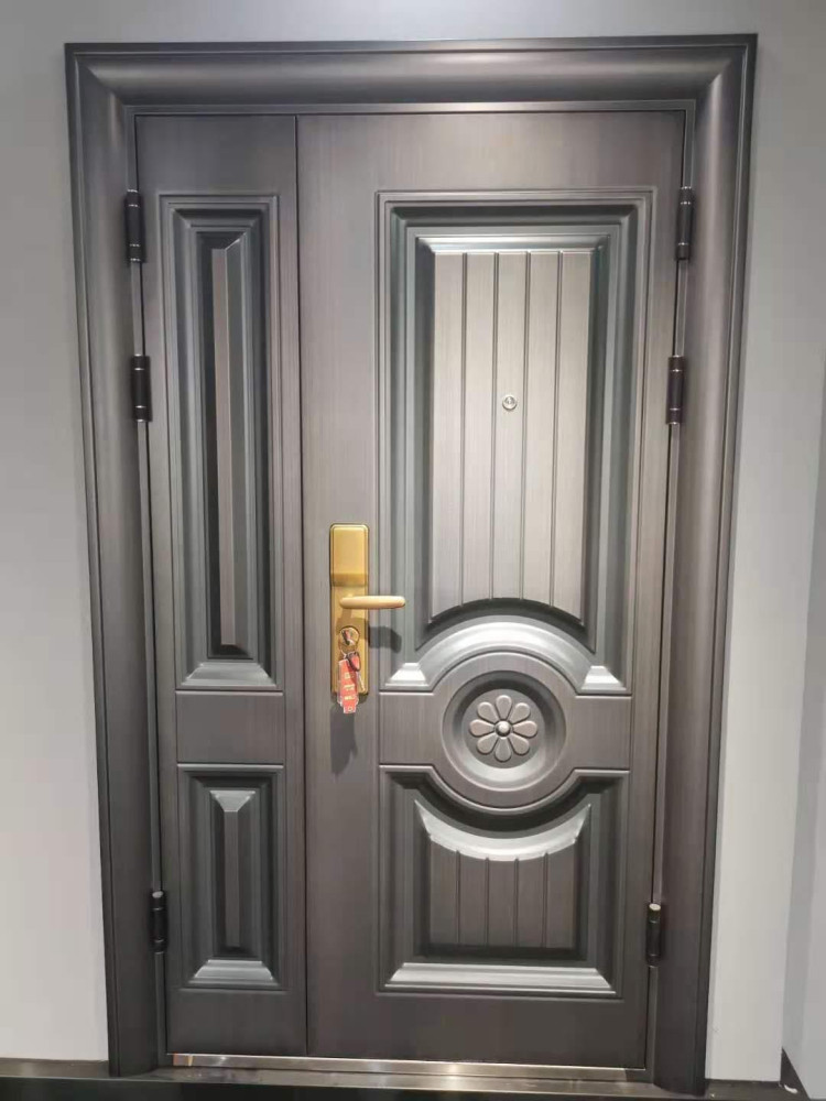 Steel Security Door a robust multi-panel design with a metalic grey finish