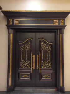 Luxury Executive Turkish Door potentially made of cast Aluminum or Steel zinc alloy with a dark finish and ornate gold-coloured