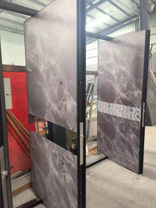 Pivot Door with a marble-effect panel 