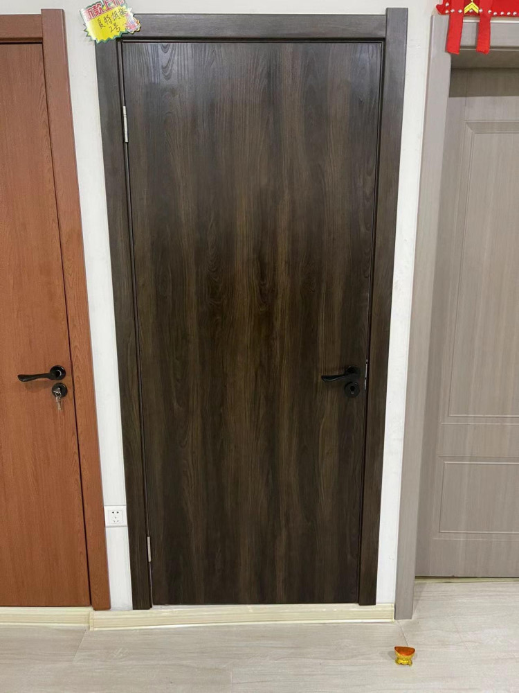 Dark Brown Composite Single leaf wooden Door with a black lever handle set