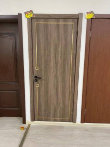 Modern Interior Door with a wood-grain melamine or PVC finish and gold trim