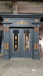 Grey and Gold cast Metal Security Door with a decorative elements and robust construction