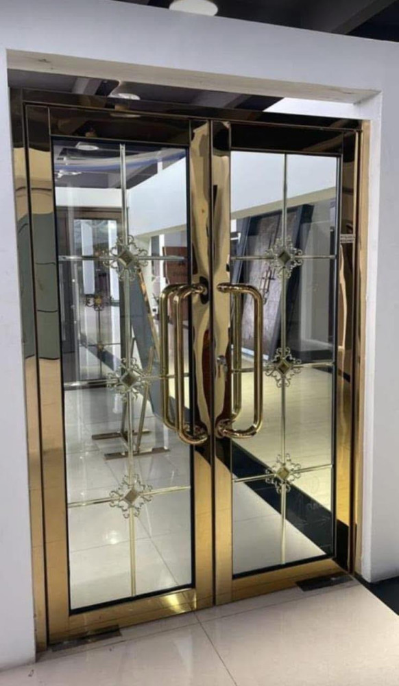 Gold-framed Glass Doors with a Decorative Metawork