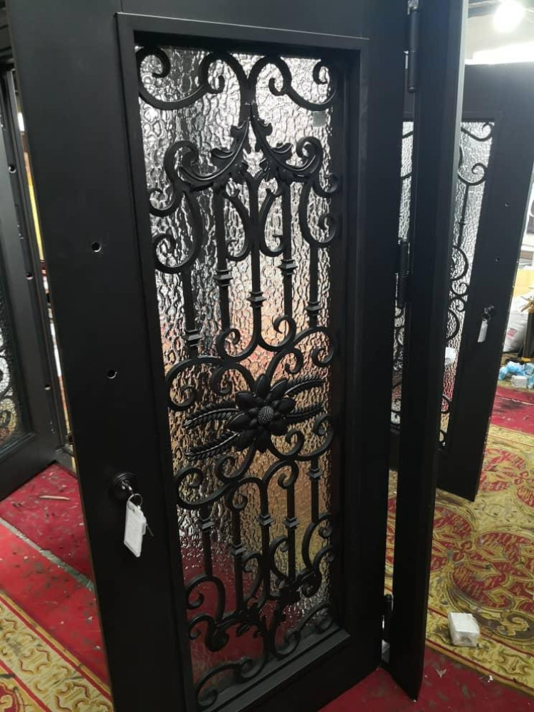 Black Wrought Iron with an intricate, ornamental Design and textured glass Panels