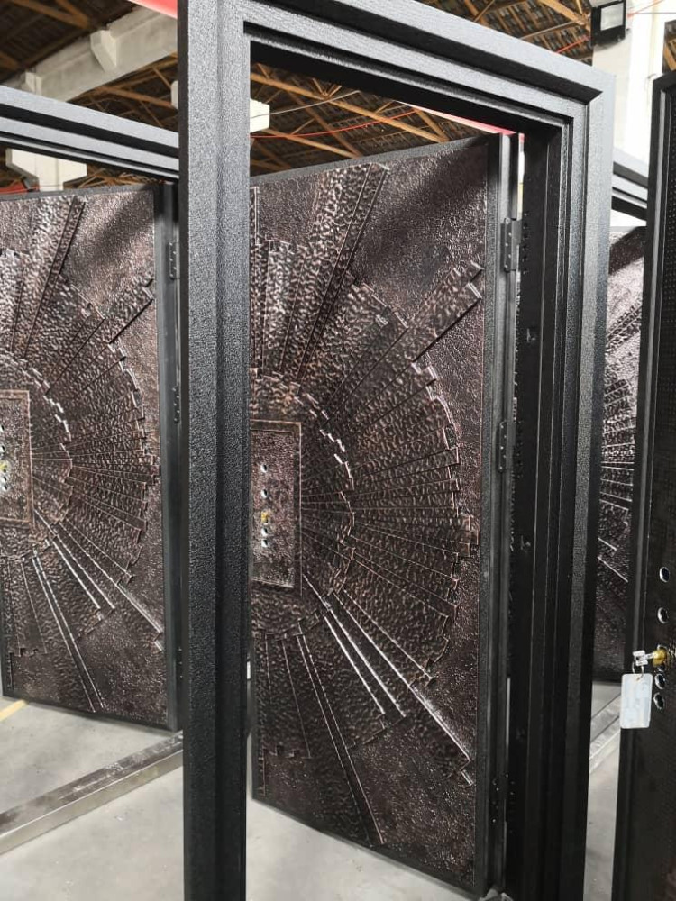 Heavy-duty ornate Steel Seurity Door with distinctive textured, sun-burst-like design