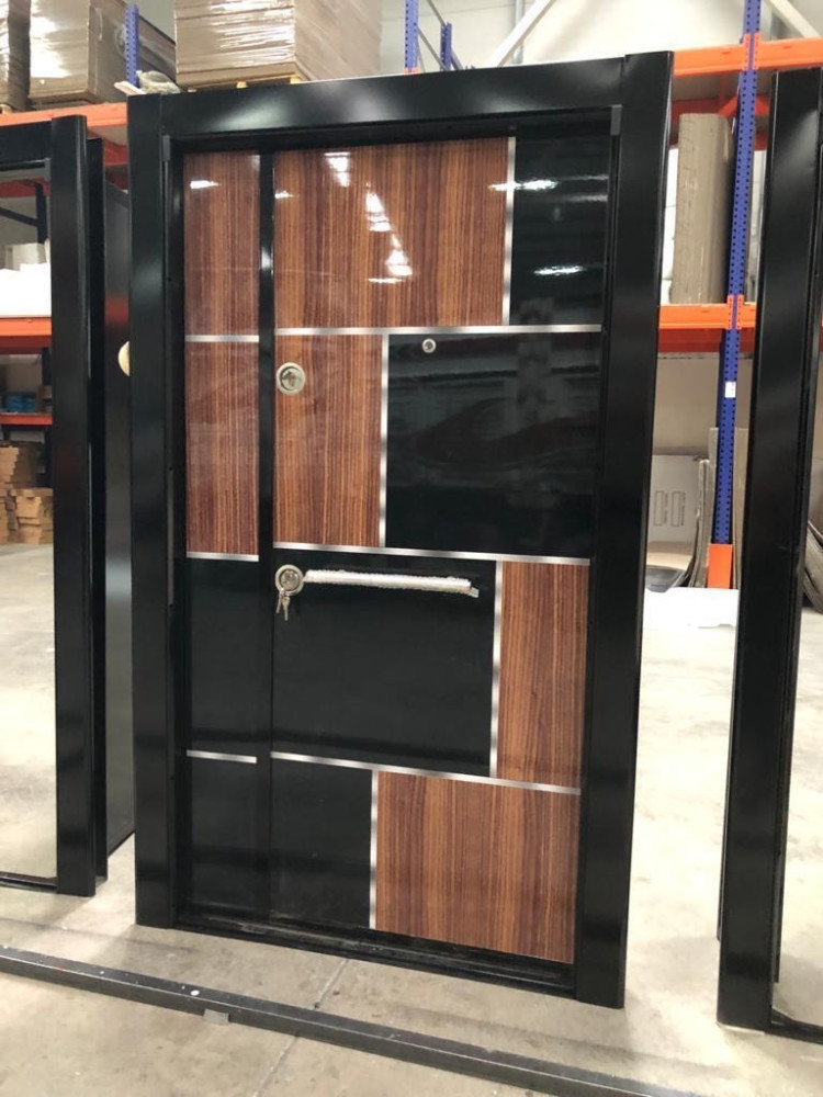 Turkish Security Door featuring a modern design with a mix of wood-finish and black panels