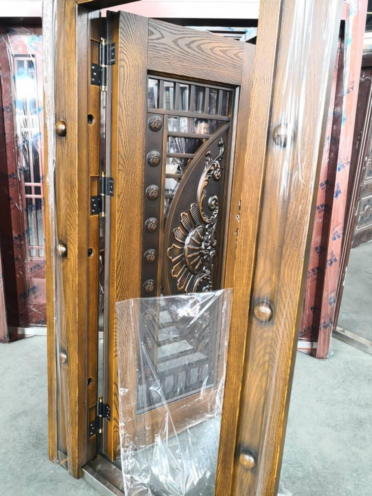 Security Door with a wood-grain finish and decorative metal work 