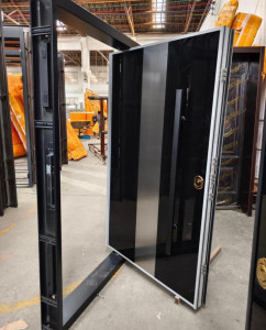 Modern Black and silver accent pivot door likely a security door