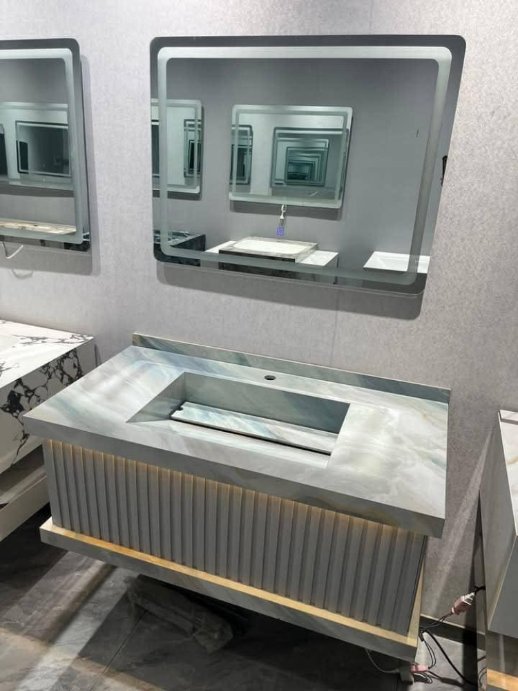 Modern Floating bathroom vanity with a marble top and LED smart mirror 