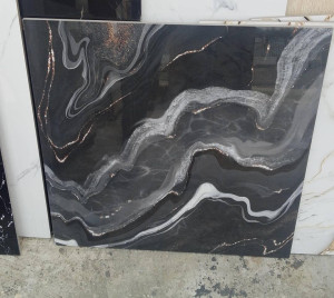 Polished black tile or slab with dramatic white and gold veining 