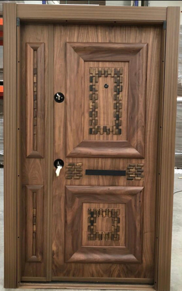 Turkish Security Door with a wood finish and decorative metal insert