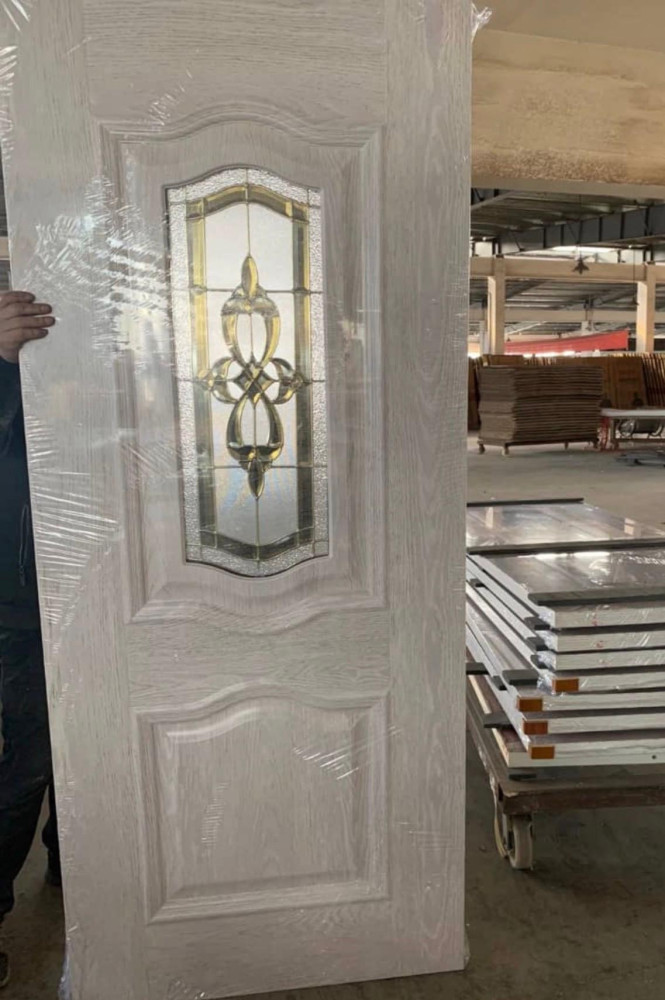 Exterior Door featuring a decorative glass insert with clear bevel cluster and satin nickel caming