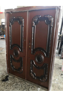 Double Steel Security Door with a copper or bronze finish and ornate black detailing