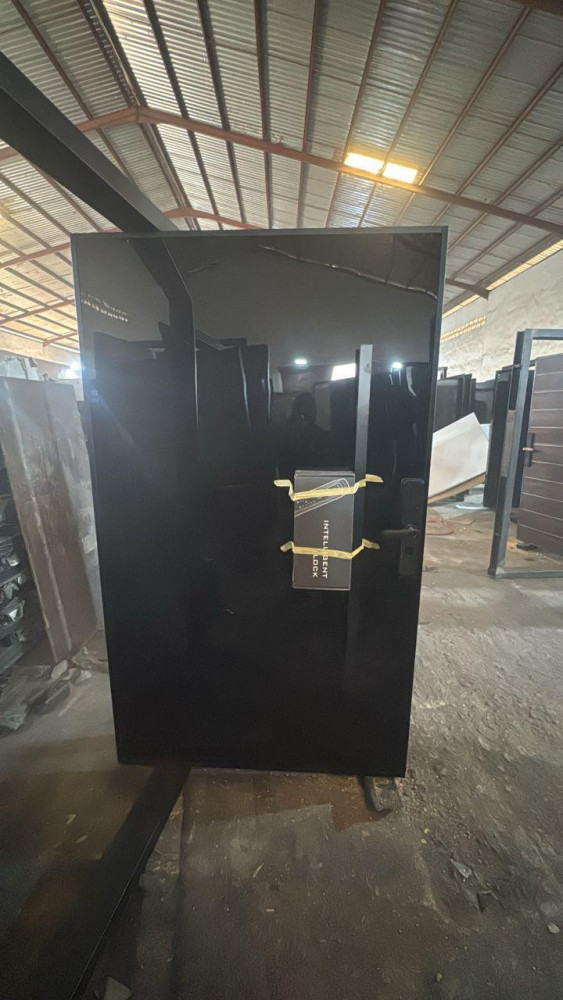 Black Door with a box for a smart or intelligent lock attached